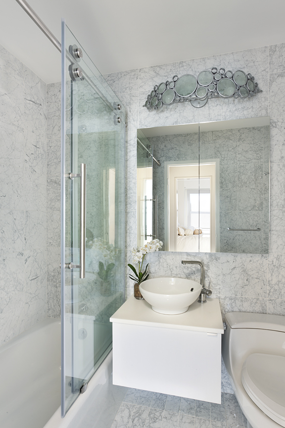 custom bathroom design with marble walls