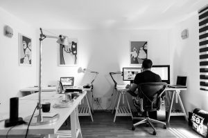 a person is working in an office room at home